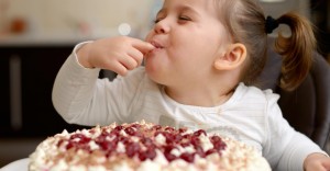 cute little girl eating cake